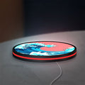 Great Wave off Kanagawa Ocean Art LED lightbox lying flat on a desk with red glow