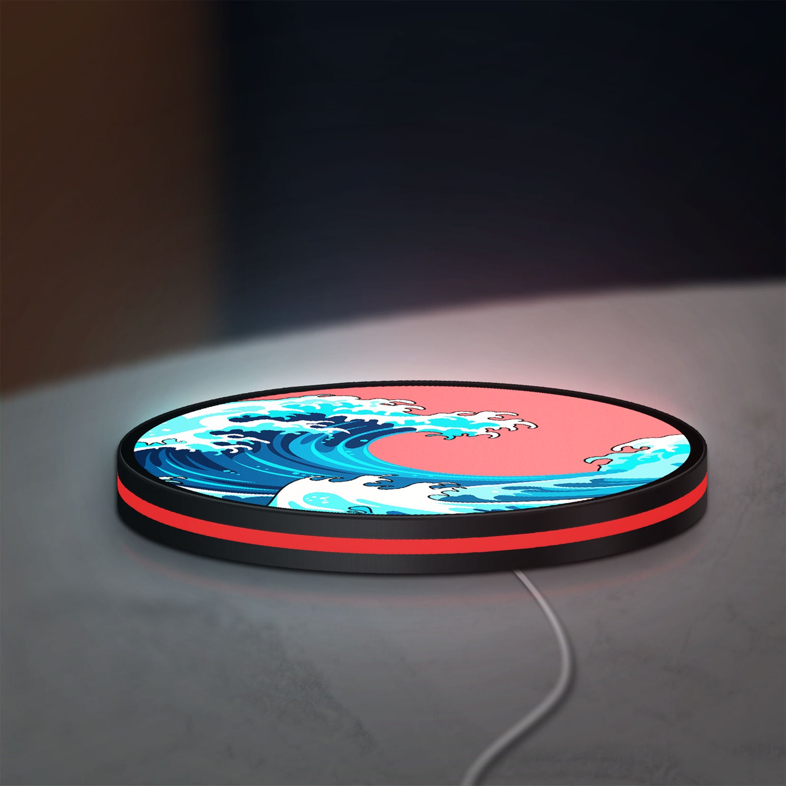 Great Wave off Kanagawa Ocean Art LED lightbox lying flat on a desk with red glow