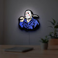 Friday the 13th Jason Mask Slasher LED lightbox hanging on a room wall with soft white light