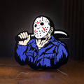 Front view of Friday the 13th Jason Mask Slasher LED lightbox sign glowing on a wooden desk