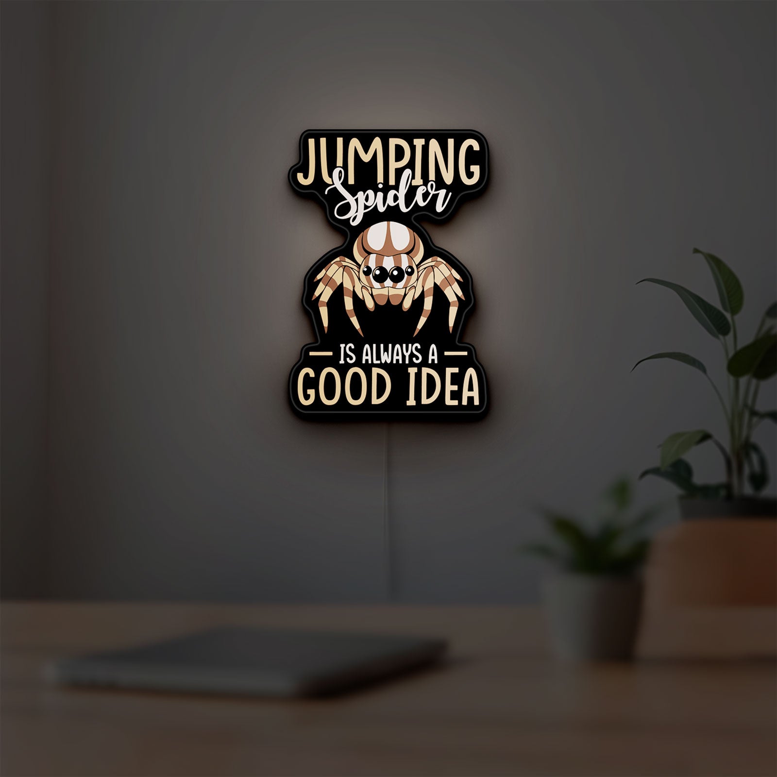 Cute Jumping Spider Arachnid Pet LED lightbox hanging on a room wall with soft white light