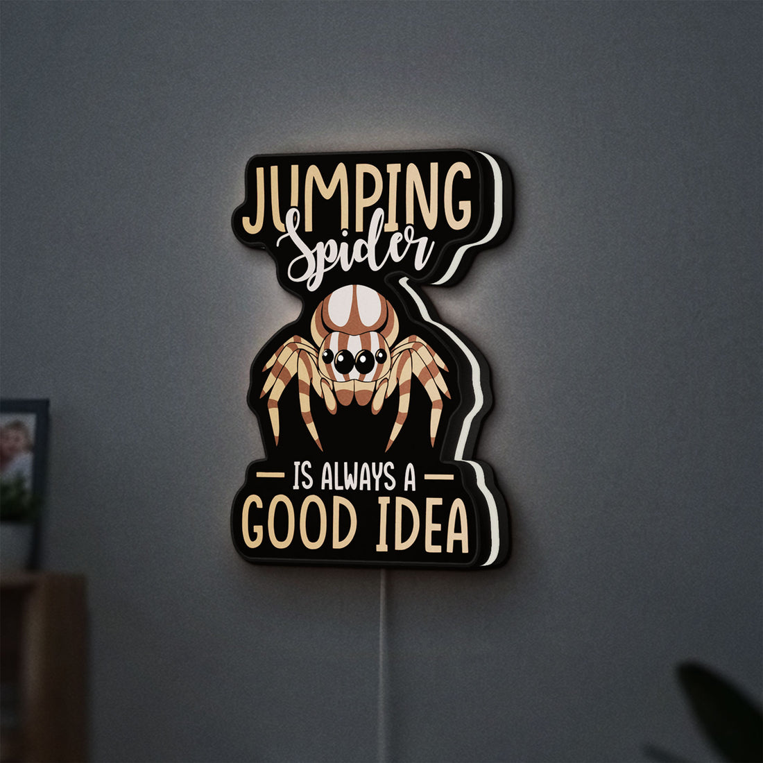 Cute Jumping Spider Arachnid Pet LED lightbox hanging on a wall with white glow