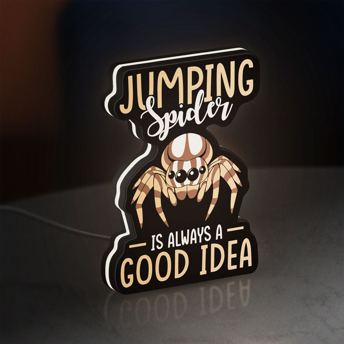 Cute Jumping Spider Arachnid Pet LED lightbox hanging on a wall with white glow
