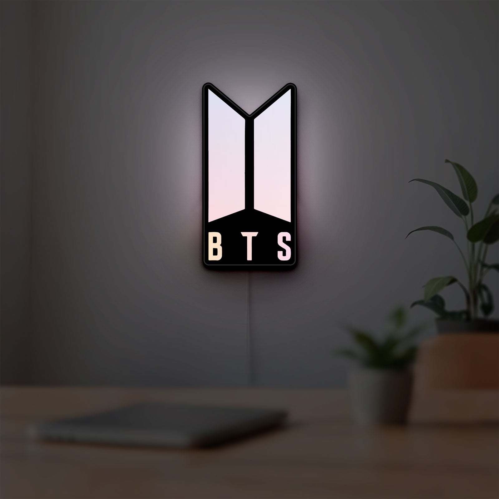 BTS ARMY Logo K-Pop Idol Music Fan LED lightbox hanging on a room wall with soft pink light