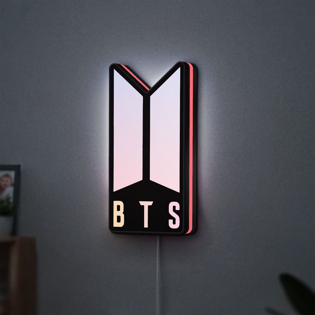 BTS ARMY Logo K-Pop Idol Music Fan LED lightbox hanging on a wall with pink glow