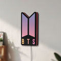 Unlit BTS ARMY Logo K-Pop Idol Music Fan LED lightbox mounted on a wall in daylight