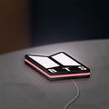 BTS ARMY Logo K-Pop Idol Music Fan LED lightbox lying flat on a desk with pink glow