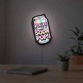 The Uncanny Counter K-Drama LED lightbox hanging on a room wall with soft pink light