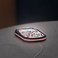 The Uncanny Counter K-Drama LED lightbox lying flat on a desk with pink glow