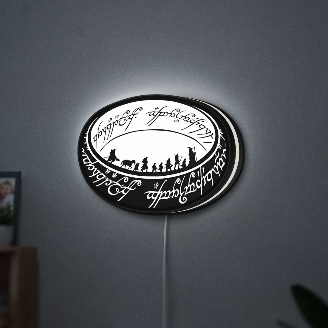 Lord of the Rings One Ring Fantasy LED lightbox hanging on a wall with white glow