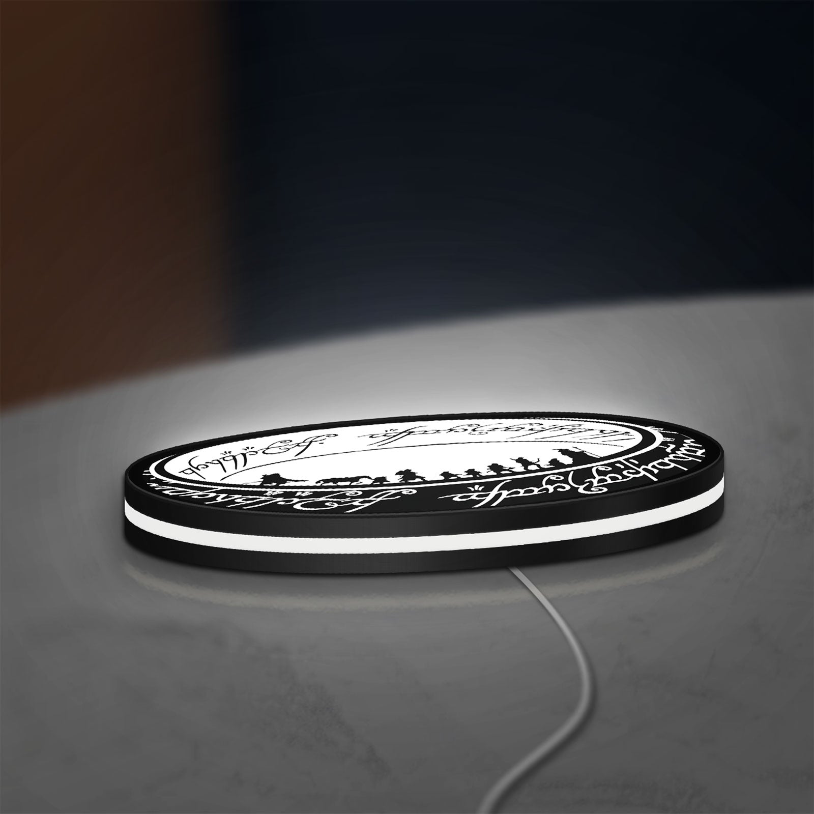 Lord of the Rings One Ring Fantasy LED lightbox lying flat on a desk with white glow