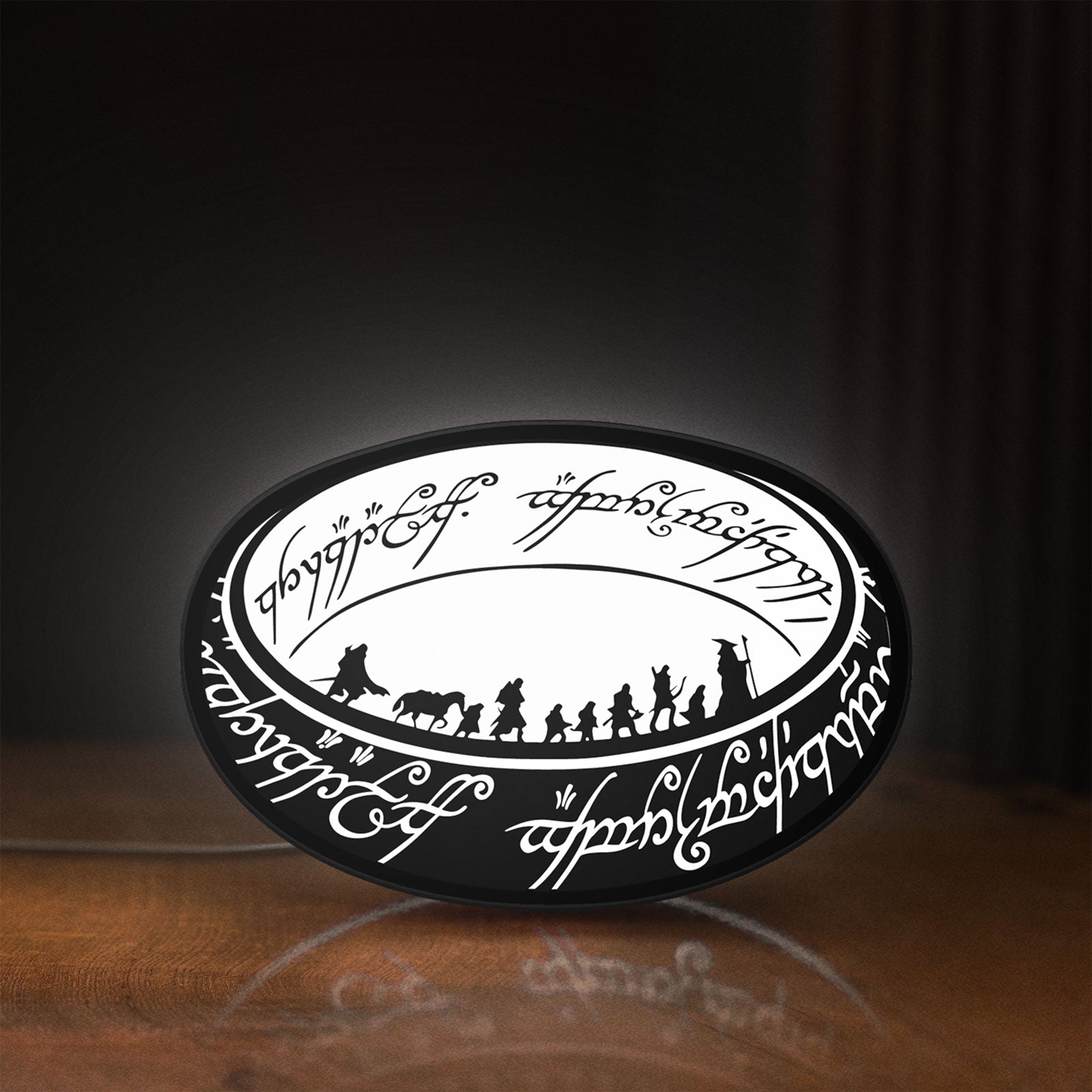 Front view of Lord of the Rings One Ring Fantasy LED lightbox sign glowing on a wooden desk
