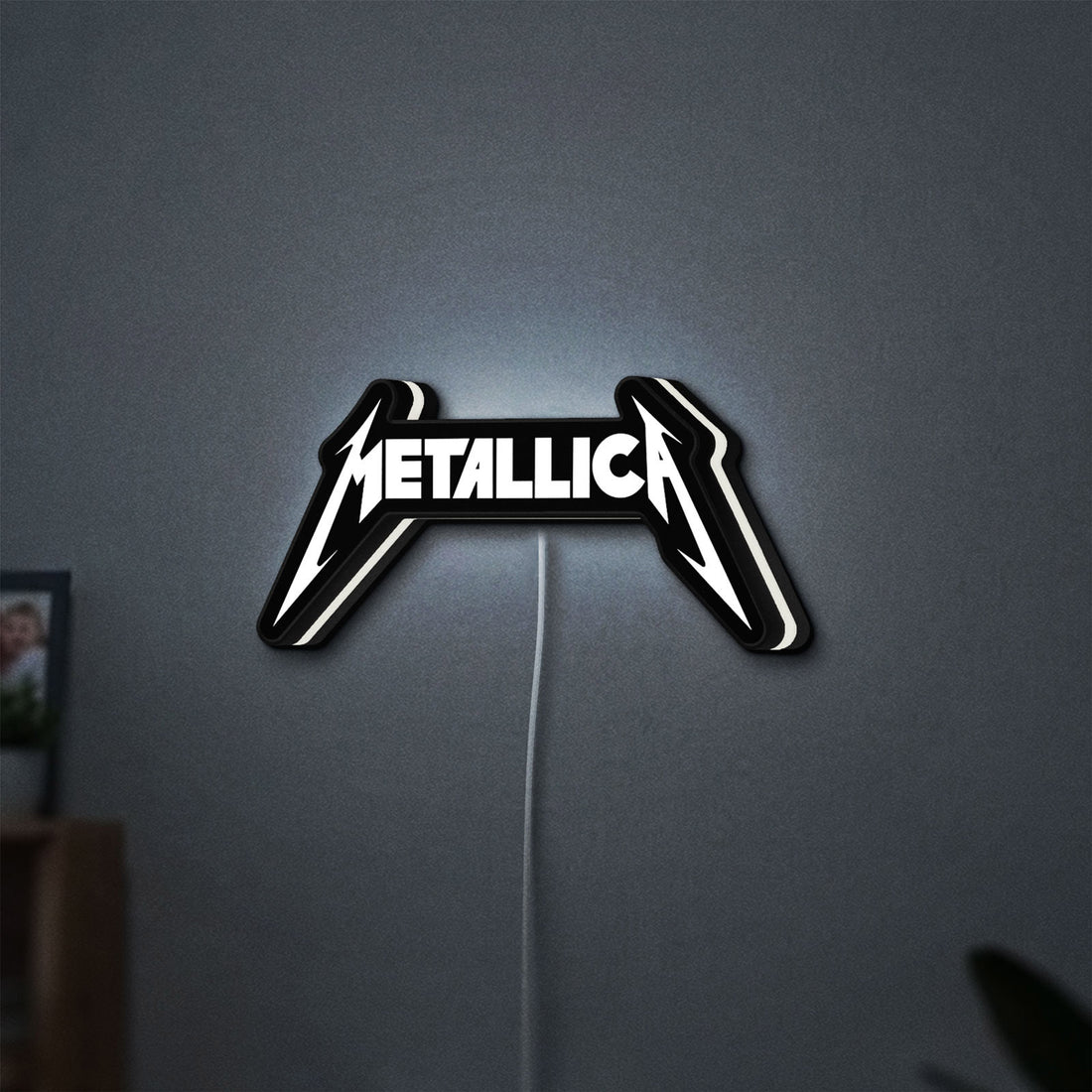 Metallica Band Logo Heavy Metal LED lightbox hanging on a wall with white glow