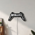 Unlit Metallica Band Logo Heavy Metal LED lightbox mounted on a wall in daylight
