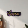 Unlit Minnesota Vikings NFL Pro Football LED lightbox mounted on a wall in daylight