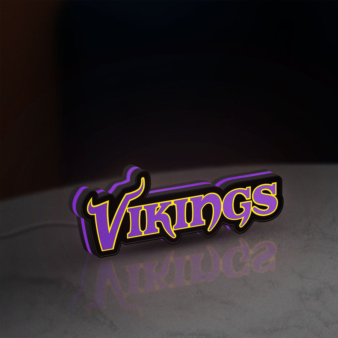 Minnesota Vikings NFL Pro Football LED lightbox hanging on a wall with purple glow