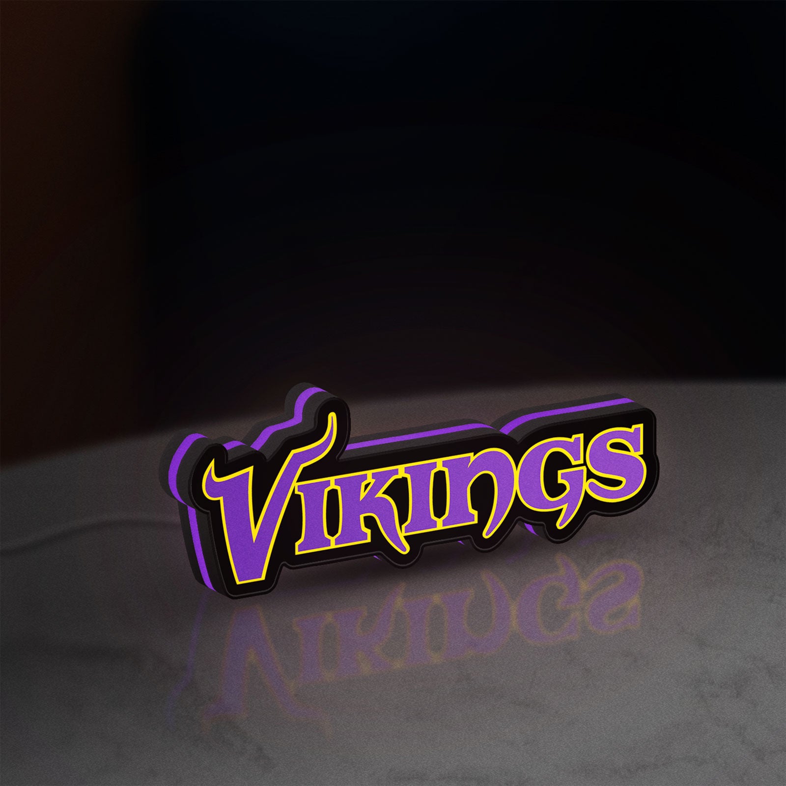 Minnesota Vikings NFL Pro Football LED lightbox standing on a desk from an angled side view with purple glow