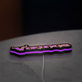 Minnesota Vikings NFL Pro Football LED lightbox lying flat on a desk with purple glow