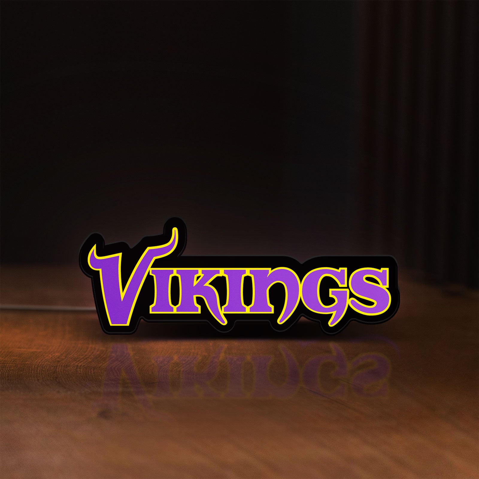 Front view of Minnesota Vikings NFL Pro Football LED lightbox sign glowing on a wooden desk