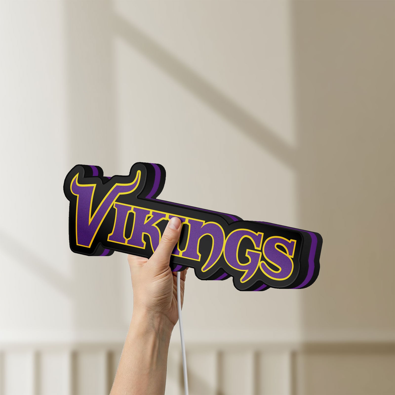 Unlit Minnesota Vikings NFL Pro Football LED lightbox held by hand to show size and details
