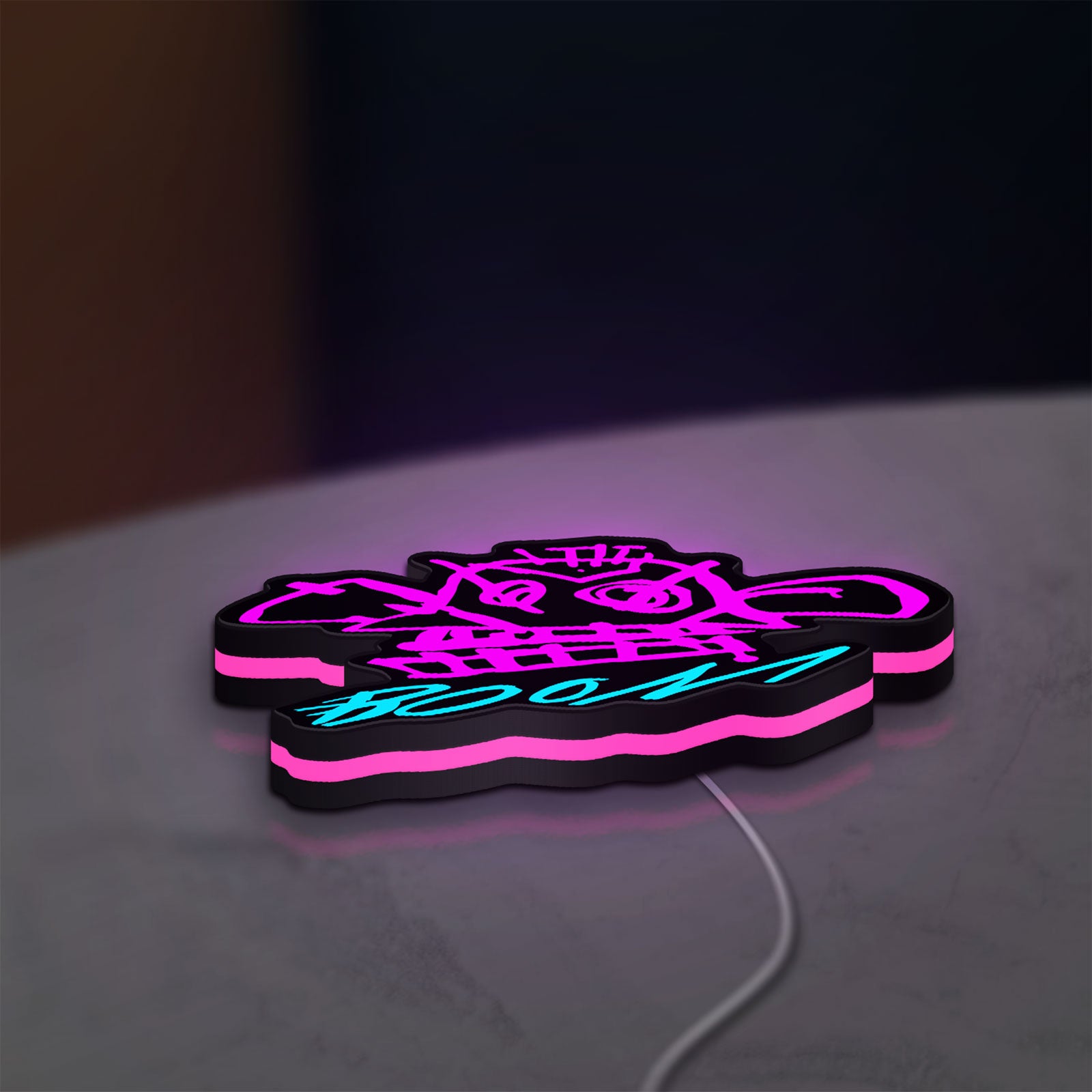 Arcane Jinx Monkey Graffiti LoL LED lightbox lying flat on a desk with pink glow