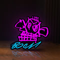 Front view of Arcane Jinx Monkey Graffiti LoL LED lightbox sign glowing on a wooden desk