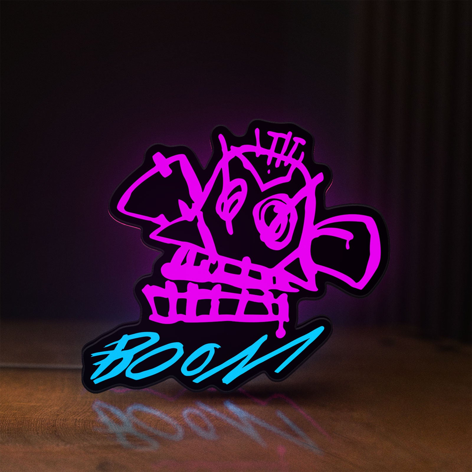 Front view of Arcane Jinx Monkey Graffiti LoL LED lightbox sign glowing on a wooden desk