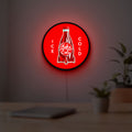 Fallout Nuka Cola Ice Cold Diner LED lightbox hanging on a room wall with soft red light