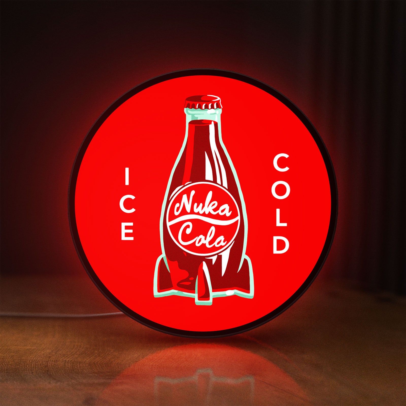 Front view of Fallout Nuka Cola Ice Cold Diner LED lightbox sign glowing on a wooden desk