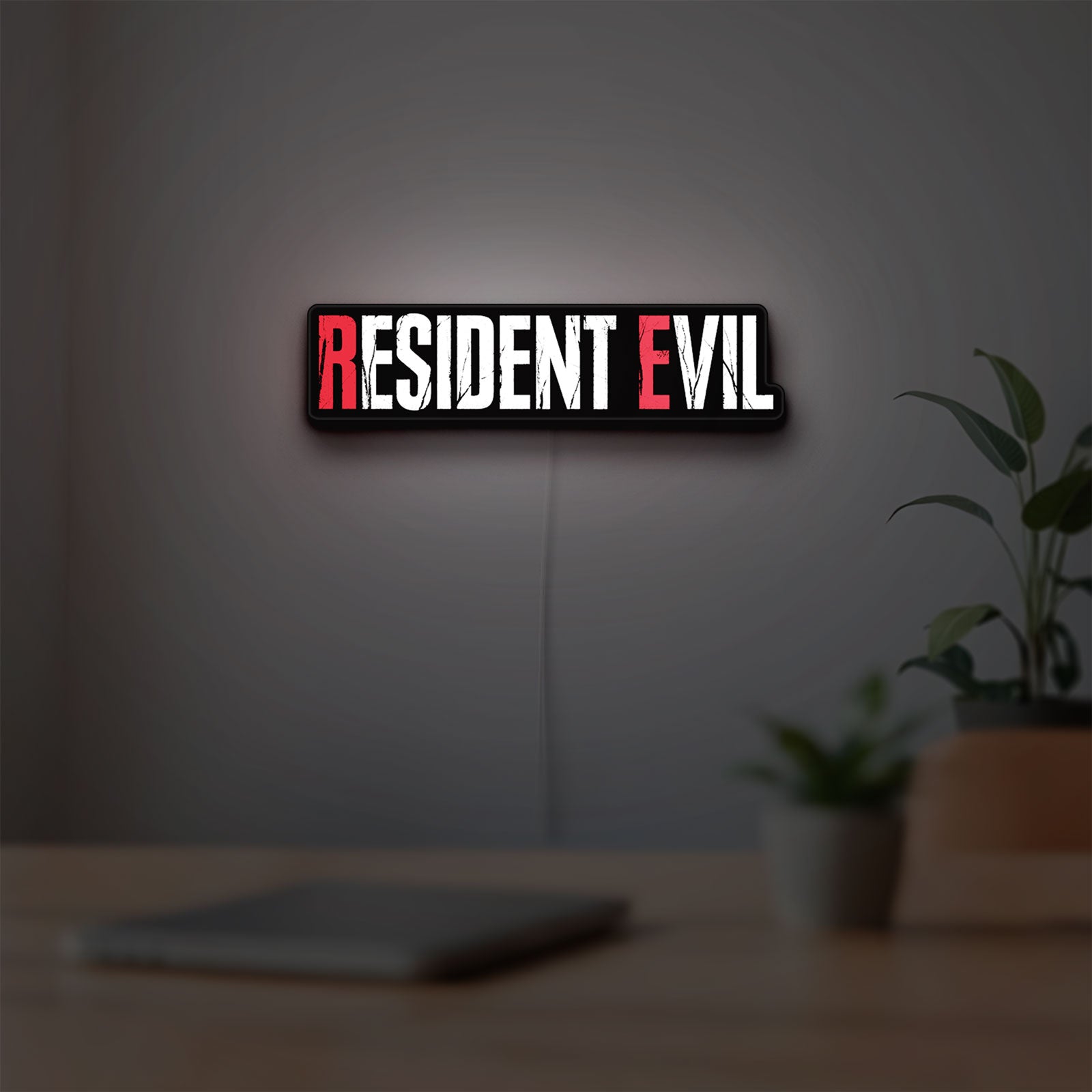 Resident Evil Umbrella Corp Horror LED lightbox hanging on a room wall with soft white light
