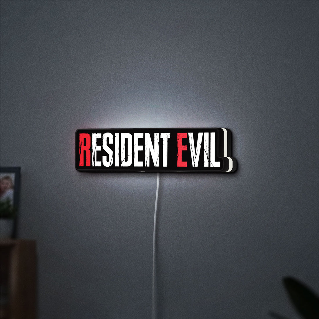 Resident Evil Umbrella Corp Horror LED lightbox hanging on a wall with white glow