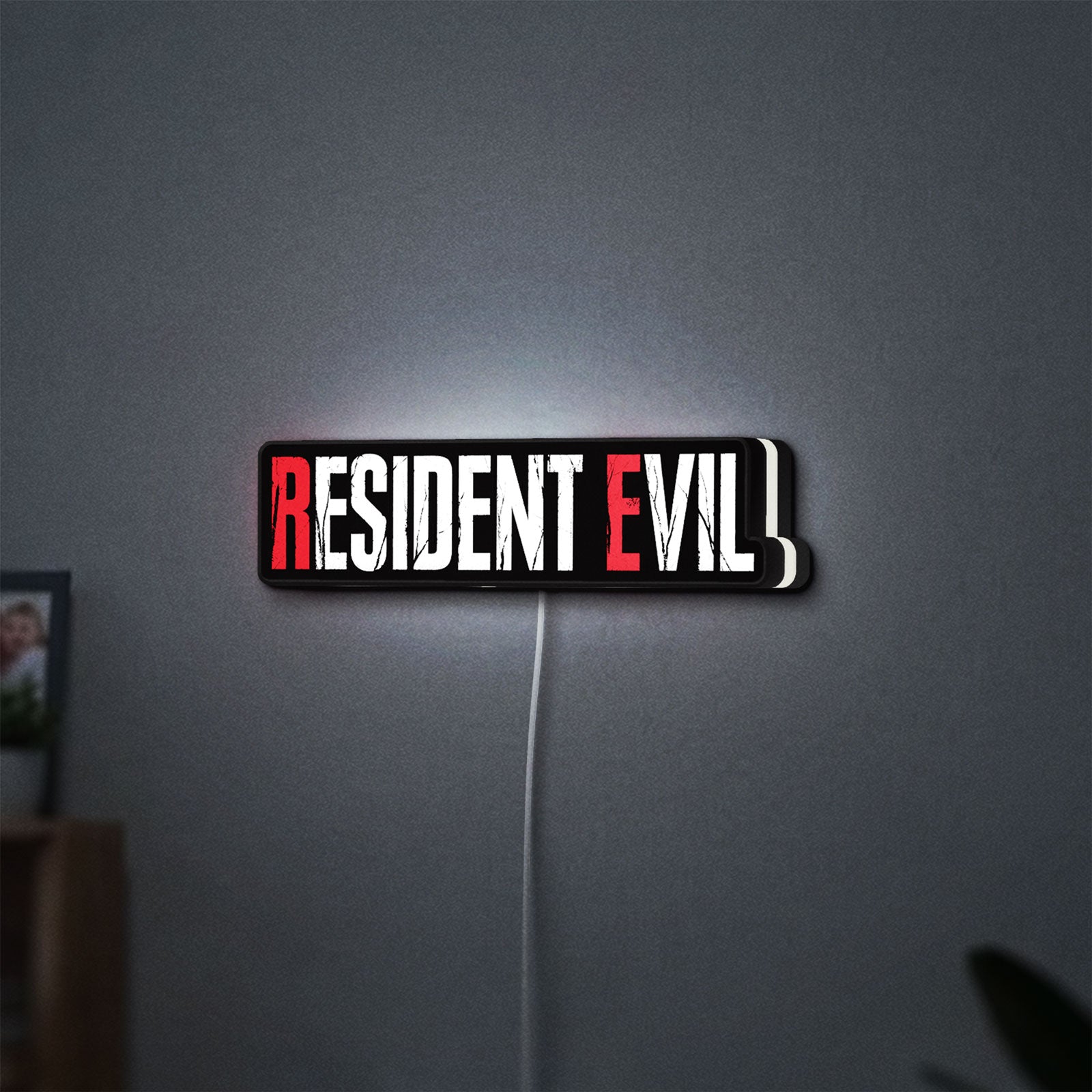 Resident Evil Umbrella Corp Horror LED lightbox hanging on a wall with white glow