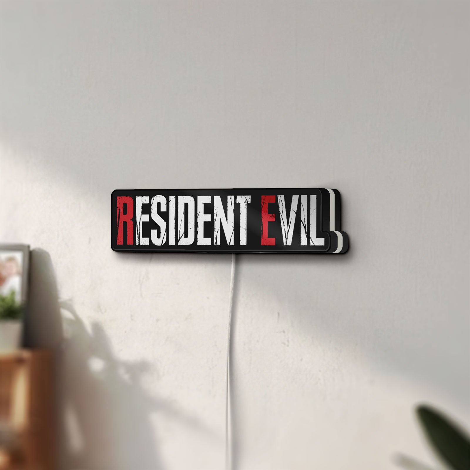 Unlit Resident Evil Umbrella Corp Horror LED lightbox mounted on a wall in daylight