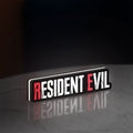 Resident Evil Umbrella Corp Horror LED lightbox standing on a desk from an angled side view with white glow