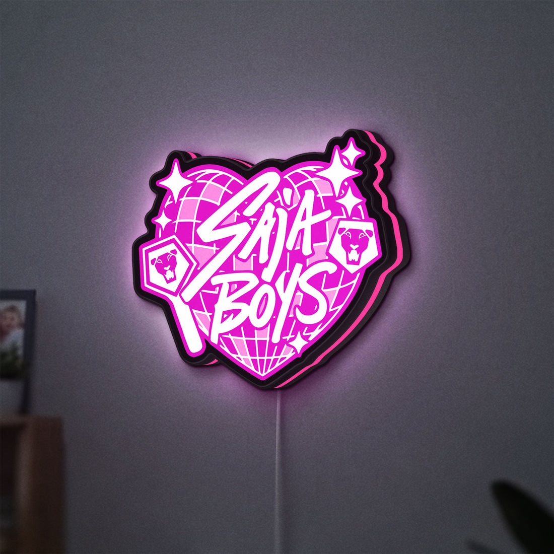 K-Pop Finger Heart Korean Idol LED lightbox hanging on a wall with pink glow