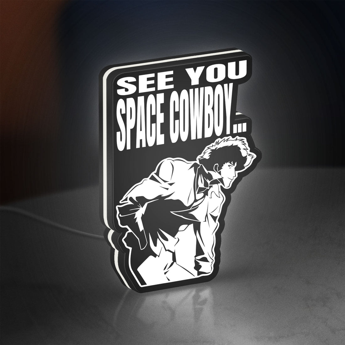 Cowboy Bebop See You Space Cowboy LED lightbox hanging on a wall with white glow