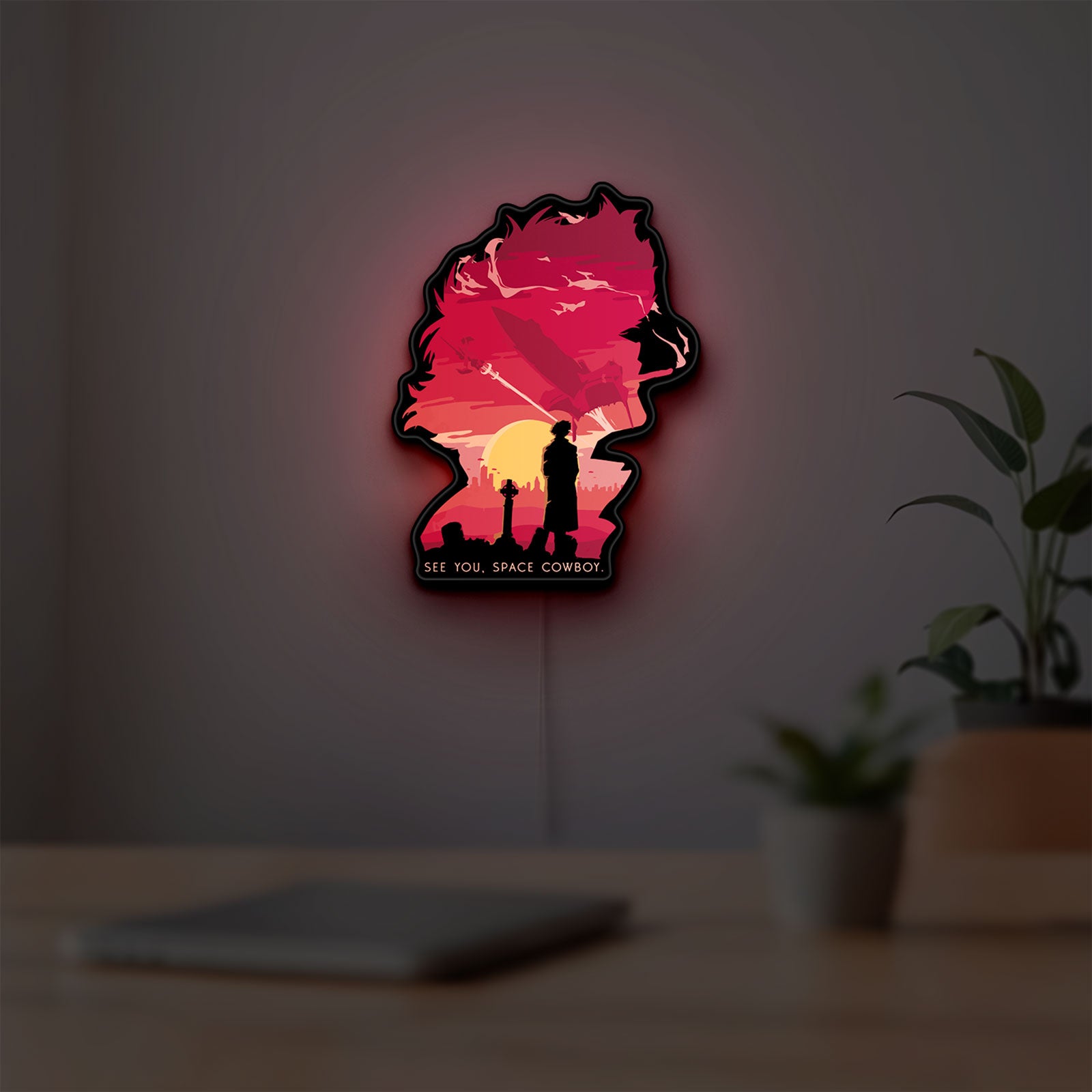 Cowboy Bebop See You Space Cowboy LED lightbox hanging on a room wall with soft red light
