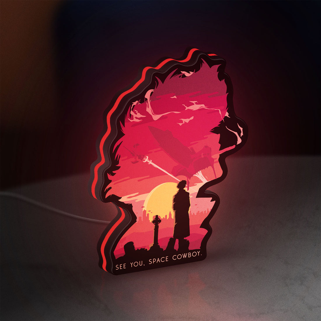 Cowboy Bebop See You Space Cowboy LED lightbox hanging on a wall with red glow