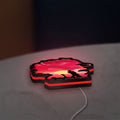 Cowboy Bebop See You Space Cowboy LED lightbox lying flat on a desk with red glow
