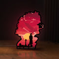 Front view of Cowboy Bebop See You Space Cowboy LED lightbox sign glowing on a wooden desk