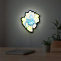 Slay the Spire Roguelike Game LED lightbox hanging on a room wall with soft white light