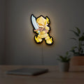Slay the Spire Roguelike Game LED lightbox hanging on a room wall with soft yellow light