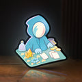 Front view of Slay the Spire Roguelike Game LED lightbox sign glowing on a wooden desk
