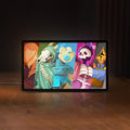 Front view of Slay the Spire Roguelike Game LED lightbox sign glowing on a wooden desk