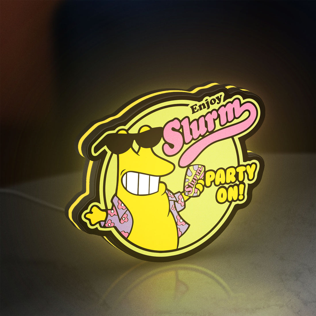 Futurama Slurm Cola Sci-Fi Comedy LED lightbox hanging on a wall with yellow glow