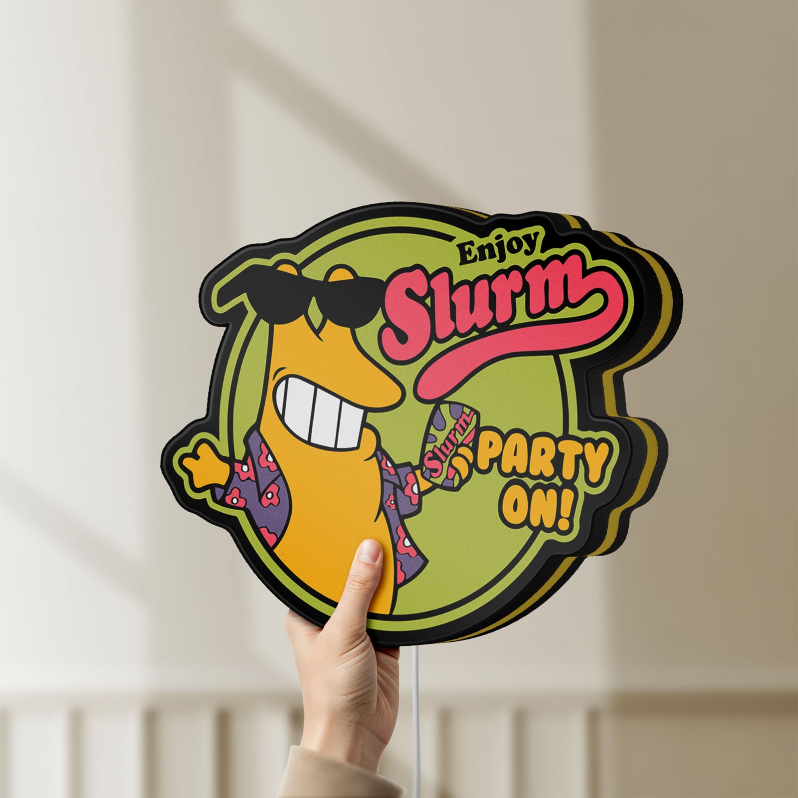 Unlit Futurama Slurm Cola Sci-Fi Comedy LED lightbox held by hand to show size and details
