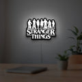 Stranger Things Logo The Upside Down LED lightbox hanging on a room wall with soft white light