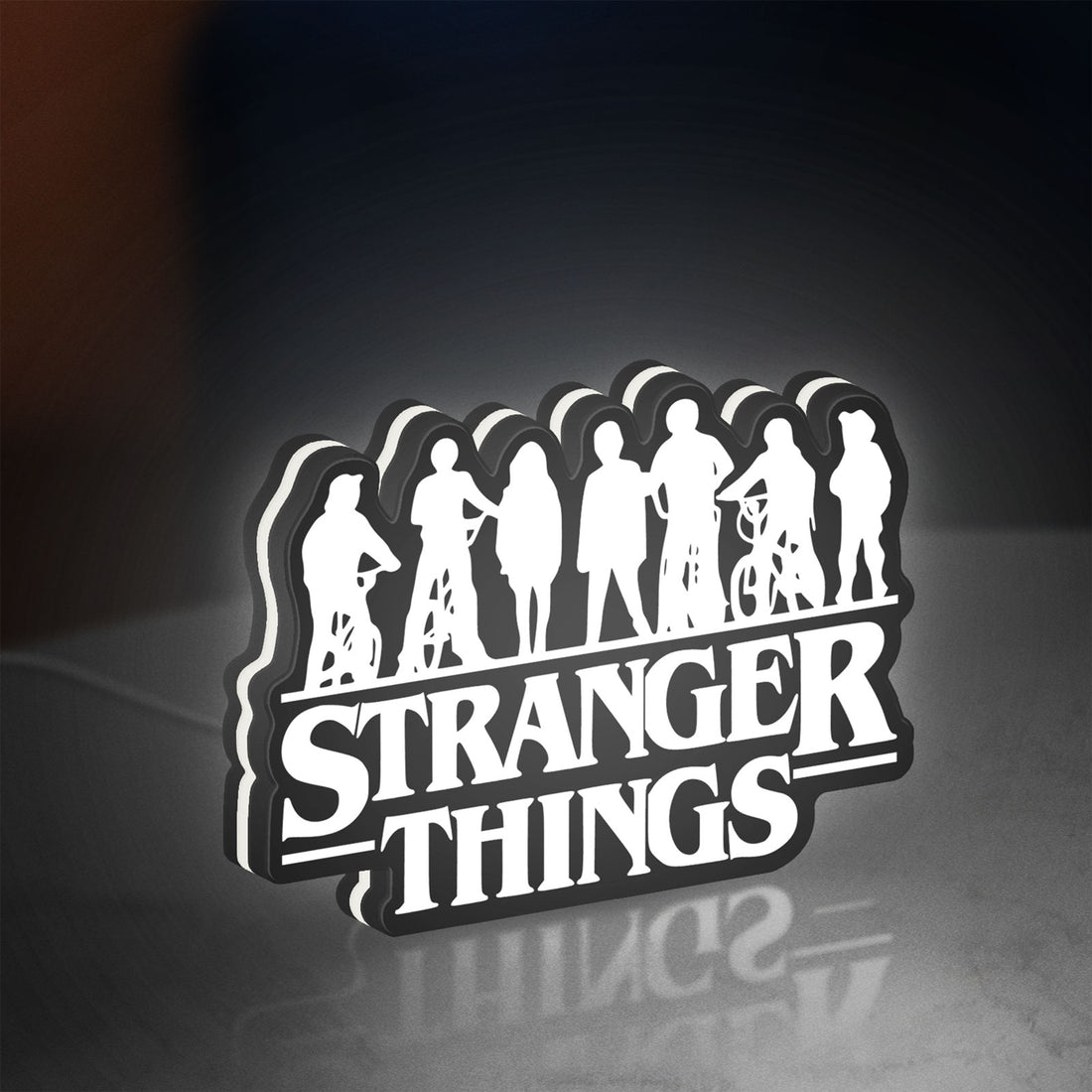 Stranger Things Logo The Upside Down LED lightbox hanging on a wall with white glow