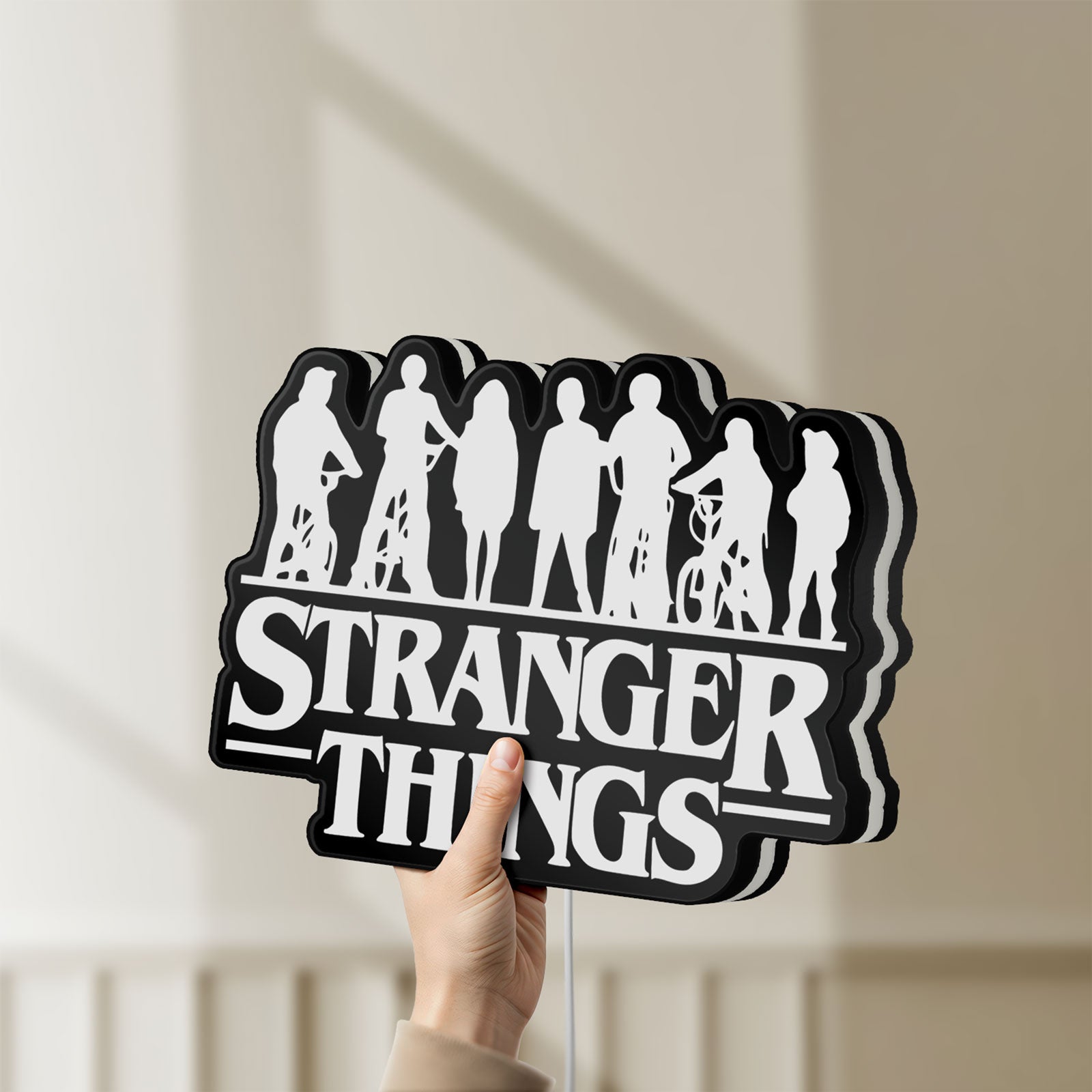 Unlit Stranger Things Logo The Upside Down LED lightbox held by hand to show size and details
