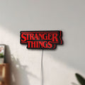 Unlit Stranger Things Logo The Upside Down LED lightbox mounted on a wall in daylight